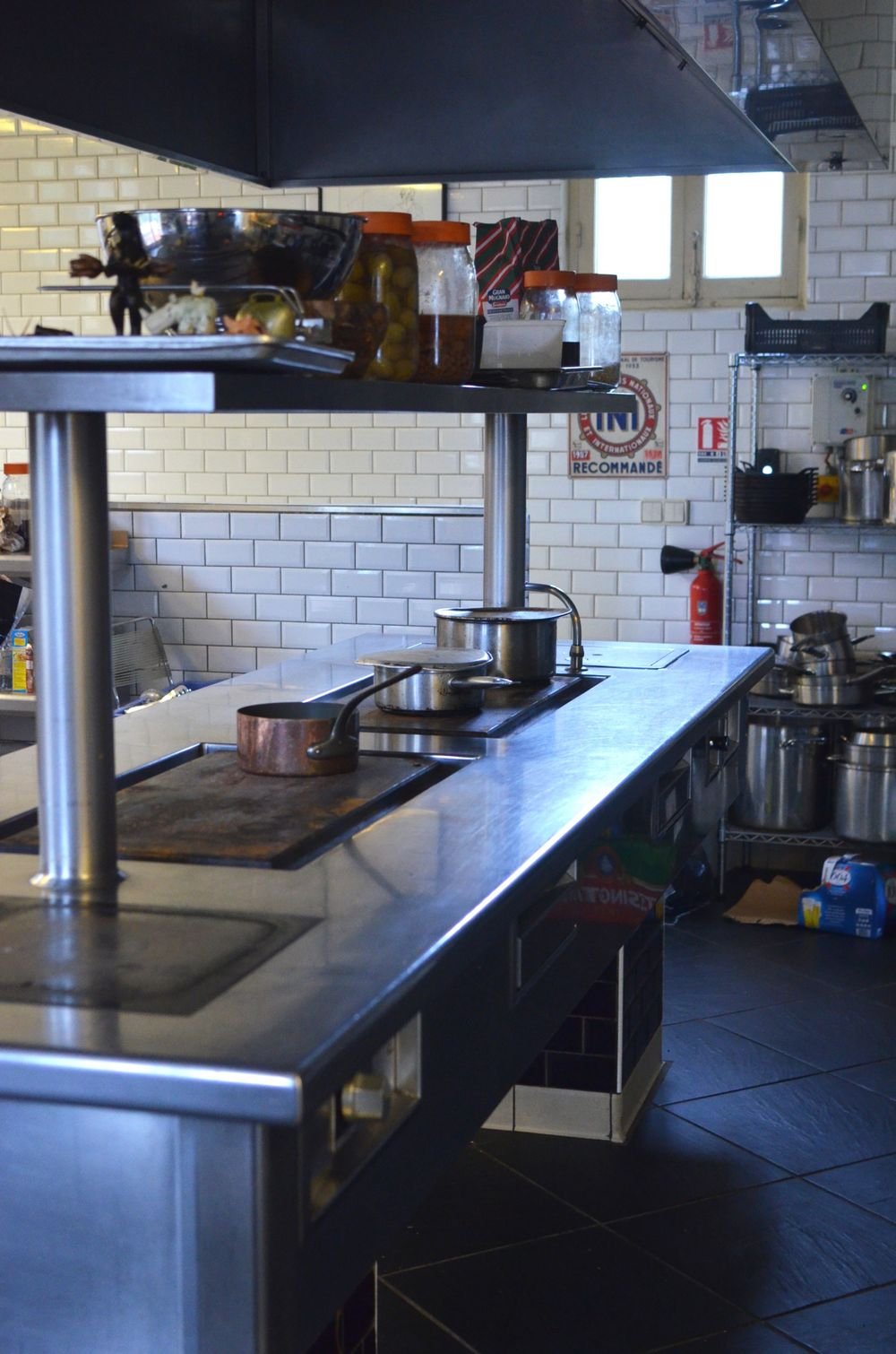Stainless steel commercial kitchen workspace.
